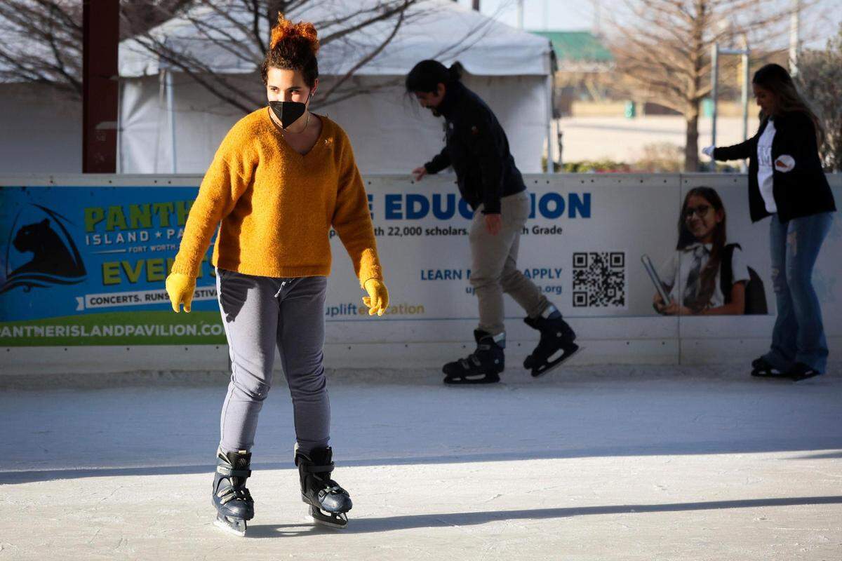 Gretchen Faught wears a mask while skating amid a COVID surge Thursday, Jan. 6, 2022, at Panther Island Ice in Fort Worth.