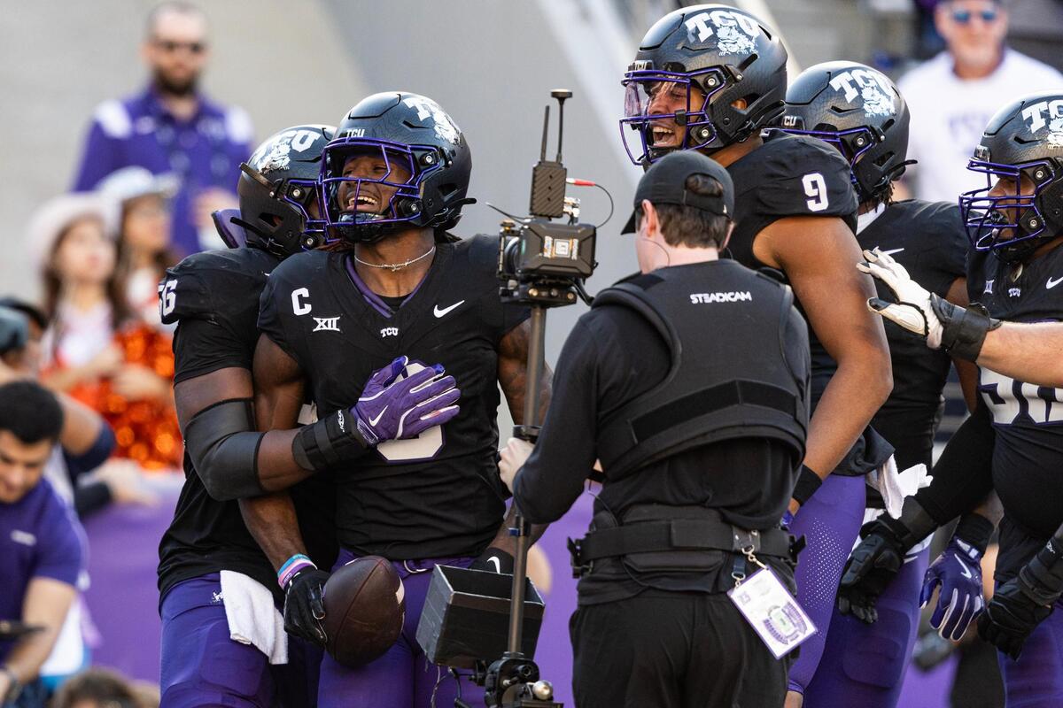 TCU wide receiver Savion Williams (3) celebrates with his teammates after scoring a touchdown to end the first half of a NCAA football game at Amon G. Carter Stadium in Fort Worth on Saturday, Nov. 23, 2024.