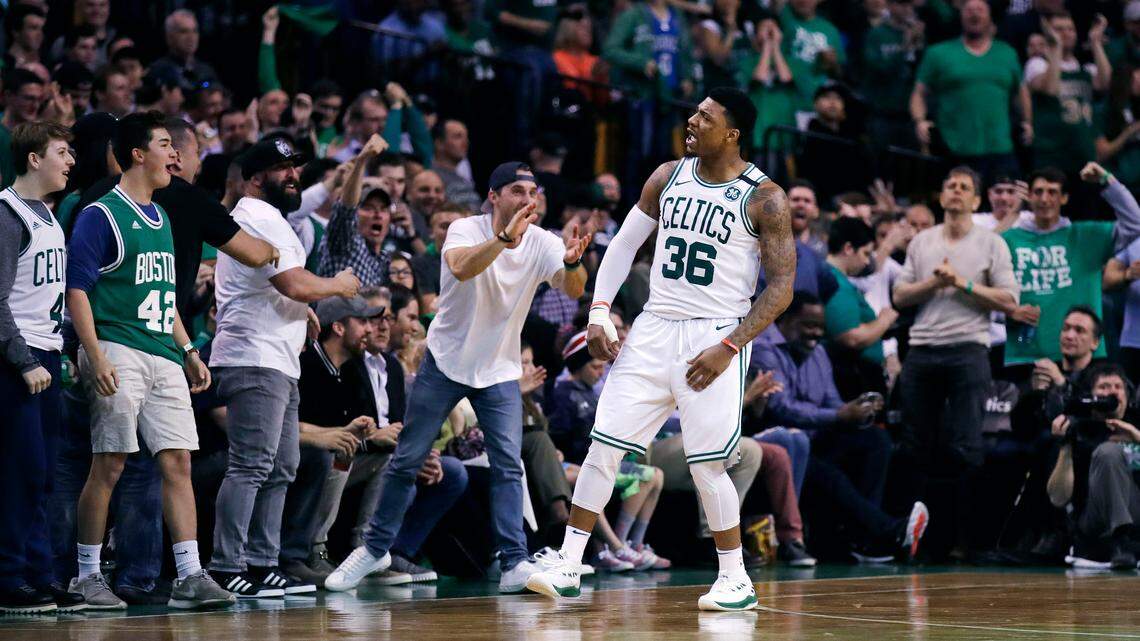 Celtics guard Marcus Smart, who attended Flower Mound High School, celebrates a basket with fans during the second quarter of a playoff game on April 28, 2018.