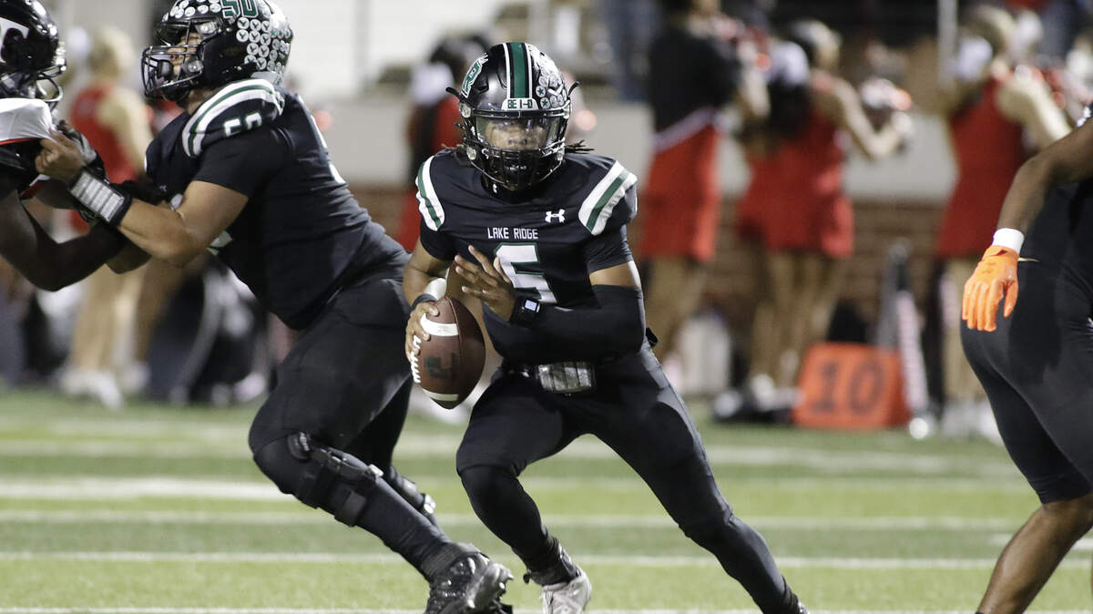 Lake Ridge’s Deshawn Edwards scrambles against Trinity Lake Ridge’s  during their Class 6A Division I bi-district game at Newsom Stadium on Friday November 14 2025 in Mansfield Texas.