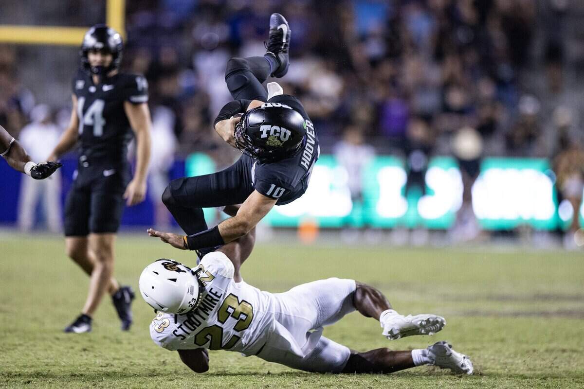 TCU quarterback Josh Hoover (10) stacked by Colorado linebacker Carter Stoutmire (23) in the second half of an NCAA football game between TCU and Colorado at Amon G. Carter Stadium in Fort Worth on Saturday, Oct. 4, 2025. TCU defeated Colorado 35-21.
