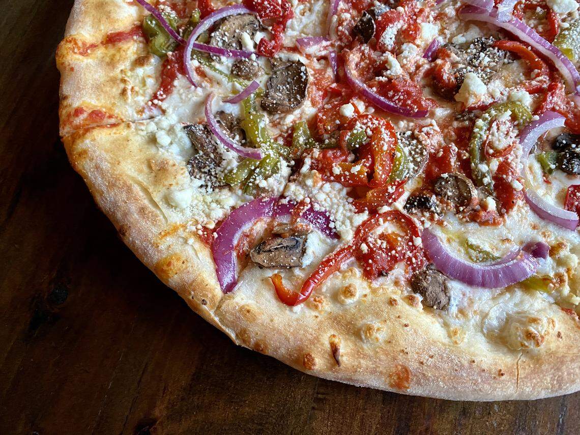 A veggie pizza at Olivella’s Pizza and Italian restaurant in west Fort Worth.