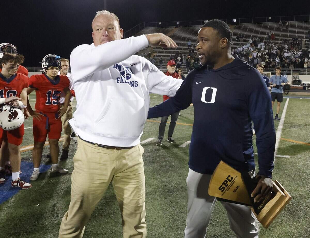 Oakridge head coach Jeromy Flowers hugged Country Day head coach Keith Burns after telling the team Burns was his coach in college after the SPC 2025 3A Football Championship football game between The Oakridge School and Fort Worth Country Day at Mavericks Stadium in Arlington, Texas, Saturday Nov. 08, 2025.