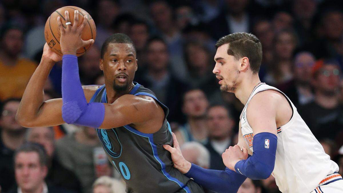 The Mavericks on Wednesday reportedly agreed to trade forward Harrison Barnes, left, to the Sacramento Kings for Justin Jackson and Zach Randolph.
