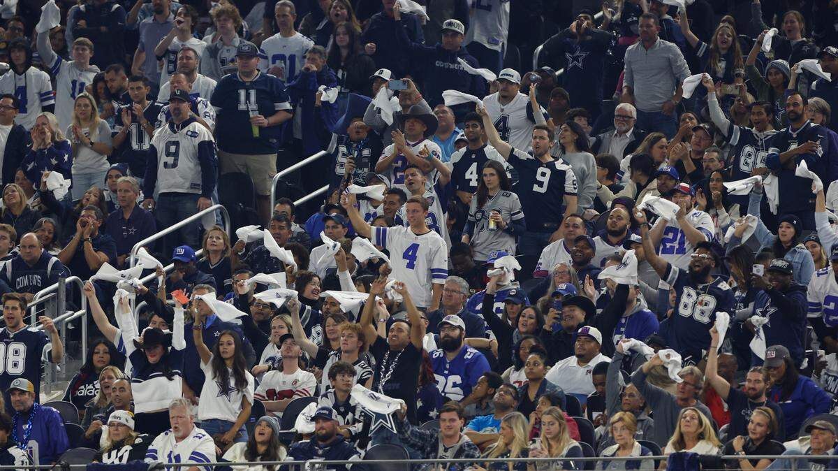 Dallas Cowboys fans cheer during an NFL football game against the New York Giants on Thursday, November 24, 2022, in Arlington, Texas. (AP Photo/Matt Patterson)