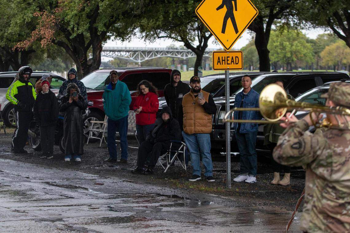 Dozens of people gathered to wave to the Veterans Day Parade winding through Fort Worth on Friday, Nov. 11, 2022. Despite rain, hundreds of participants marched down North Forest Park Boulevard, waving American flags and signing a medley of military songs.