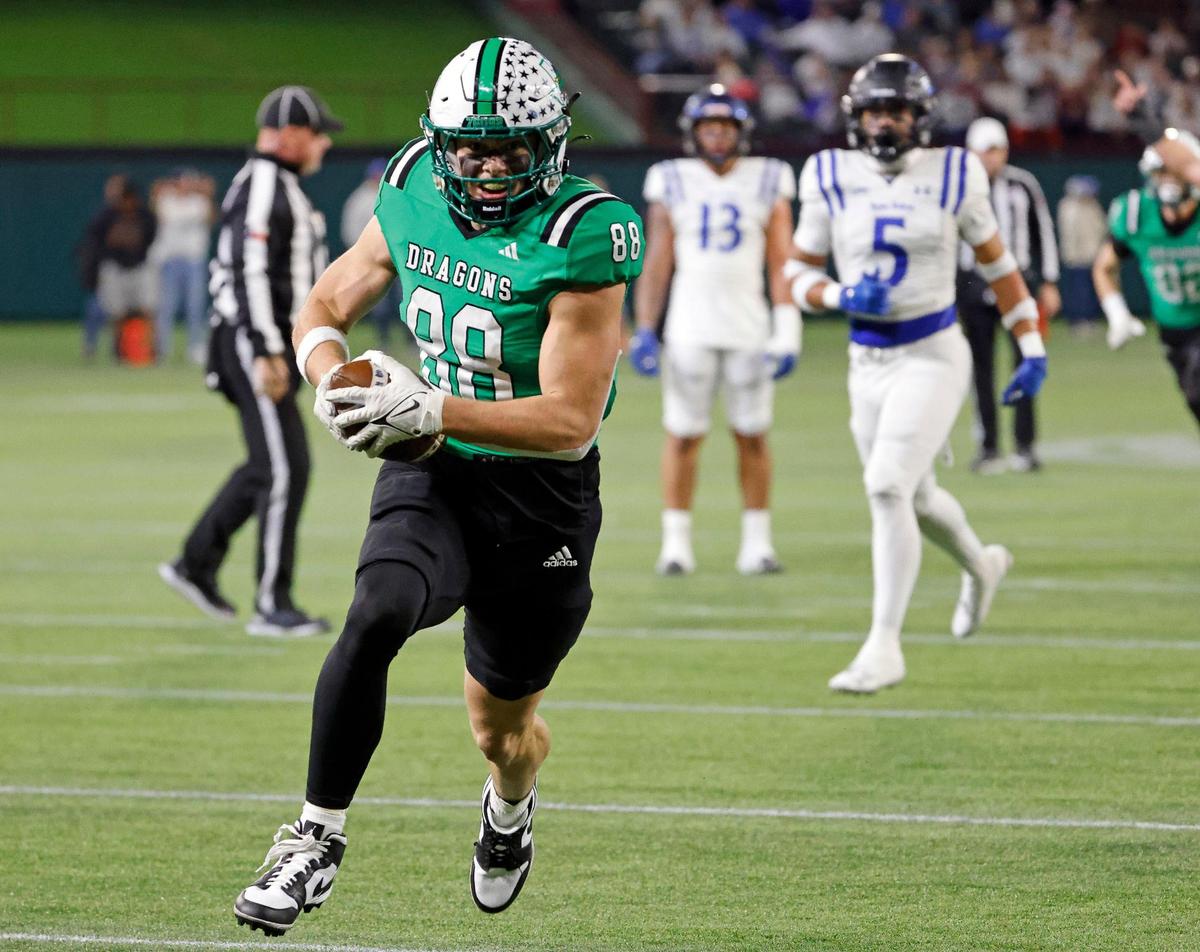 Carroll tight end Jack Van Dorselaer (88) takes a catch in for six during the first half of a UIL Conference 6A Division 2 quarterfinal football playoff game at Choctaw Stadium in Arlington, Texas, Saturday, Dec. 02, 2023.