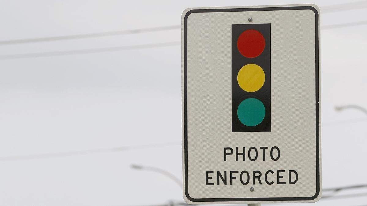 Red light cameras are used at the intersection of Division Street and Cooper Street in Arlington on Thursday, May 7, 2015. (Star-Telegram/Khampha Bouaphanh)