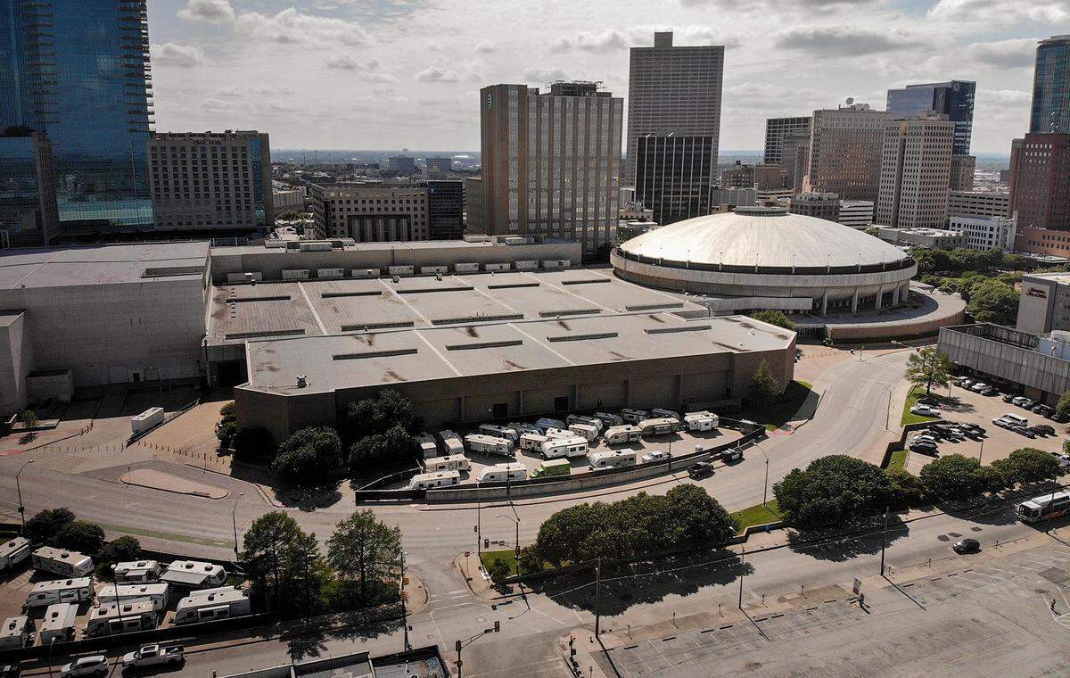 RVs parked on the east side of the convention center near the loading docks outside and near the parking garage for the Fort Worth Convention Center are being used to house homeless residents who have tested positive for coronavirus.