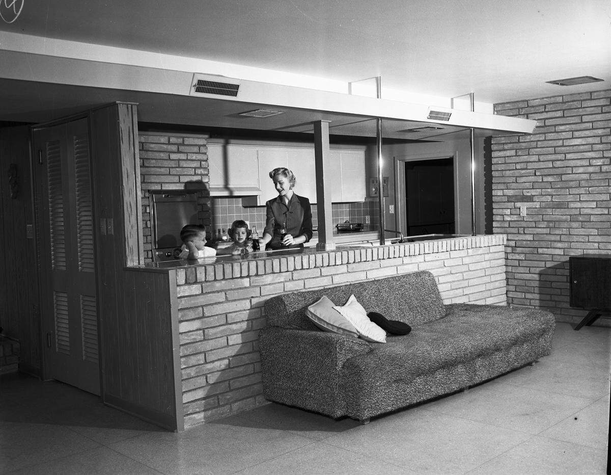 April 5, 1955: Mrs. Rogers with children Cathy and Randy in the kitchen of the family residence on Weiler Boulevard, Fort Worth.