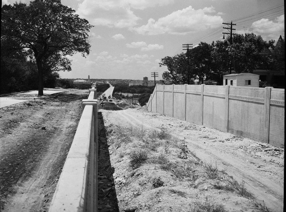 July 23, 1942: Fort Worth City Council has authorized the installation of traffic signals at the Summit Avenue intersection of this nearly completed link of West Lancaster Avenue. The new bridge across Clear Fork of the Trinity River is shown in the background.