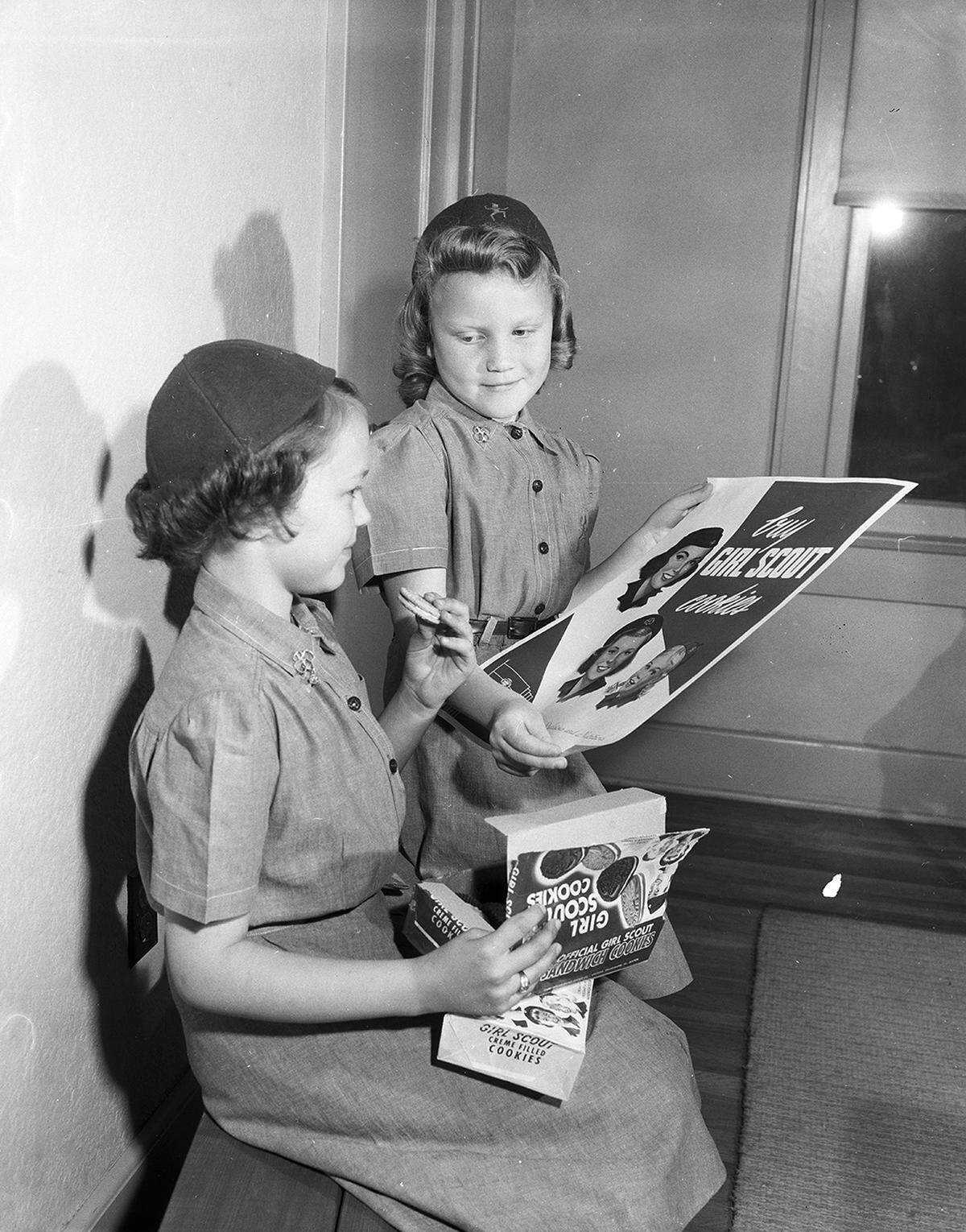 March 16, 1954: These two Brownies are among the hundreds who are selling cookies to earn money for improvements at Camp Timberlake, Girl Scout camp on Eagle Mountain Lake. Molly Howell, left, daughter of Mr. and Mrs. W.F. Howell of Handley, and Duana Thacker, daughter of Mr. and Mrs. Dewayne Thacker of Arlington, sample their product.