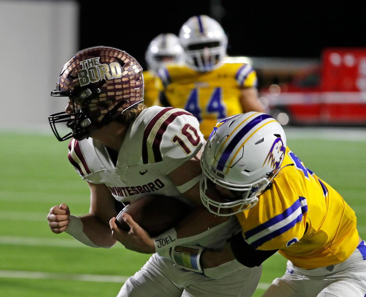 Whitesboro quarterback Mac Harper (10) is wrapped up by Brock defensive back Cole Griffith (4) in the first half of a UIL Class 3A D1 Region 1 final football game at C. H. Collins Athletic Complex in Denton, Texas, Thursday, Dec. 01, 2022. Whitesboro led 12-7 at the half. (Special to the Star-Telegram Bob Booth)