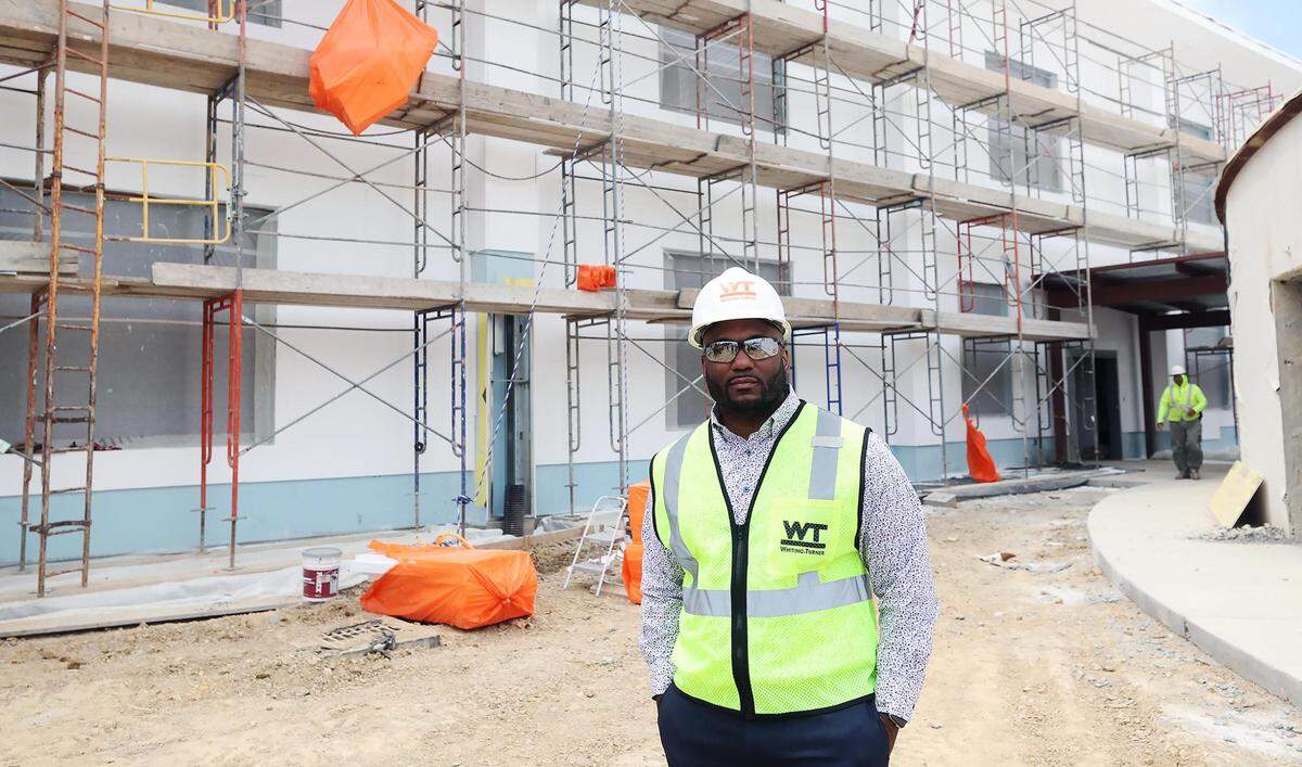 SaJade Miller, superintendent of Rocketship Public Schools Texas, stands in front of what will become Rocketship Dennis Dunkins Elementary School on May 18, 2022. Rocketship is a new charter school that will initially serve students in pre-K through third grade when it opens in August 2022.