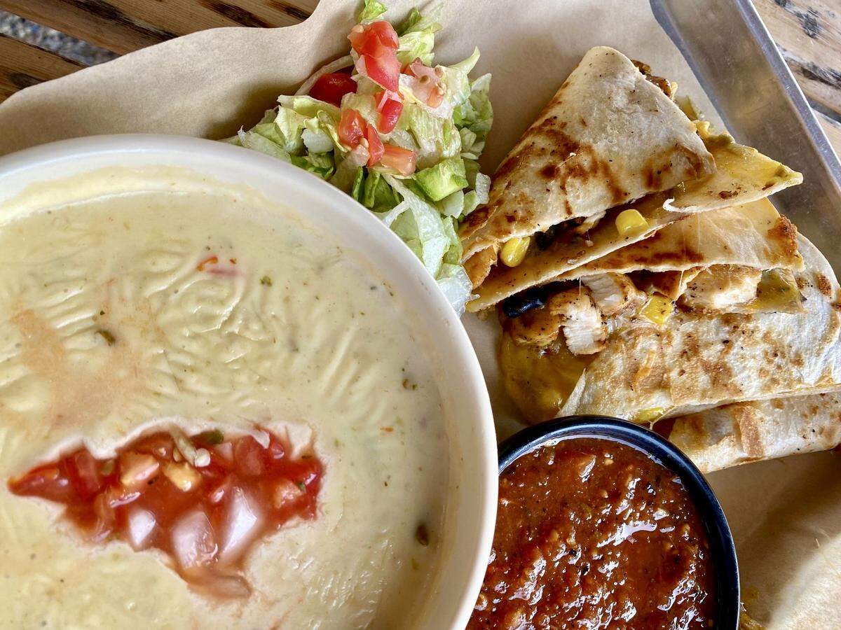 A Cajun chicken quesadilla with “lakefire” pepper queso at the Lakehouse on Eagle Mountain Lake in Fort Worth, Texas, Sept. 12, 2021.