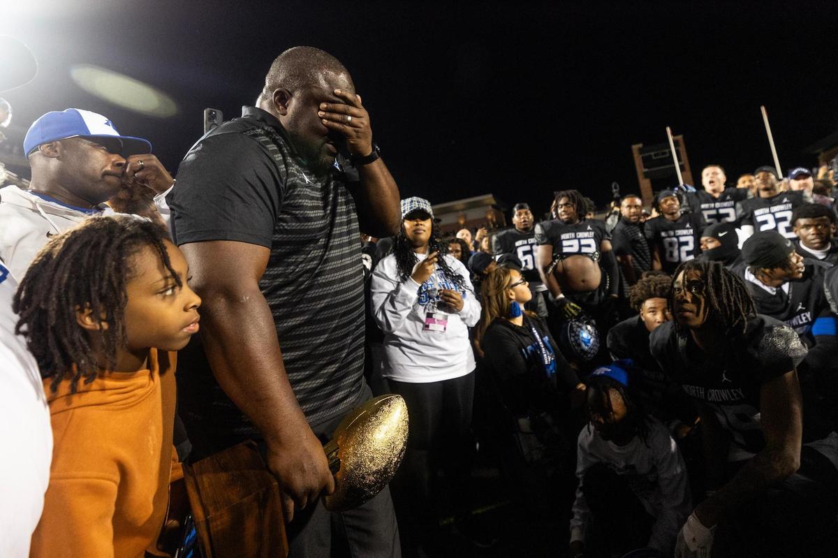North Crowley head coach Ray Gates becomes emotional speaking to his team after defeating Duncanville 36-34 in the Class 6A Division I state semifinal game at Eagle Stadium in Allen on Saturday, Dec. 14, 2024.
