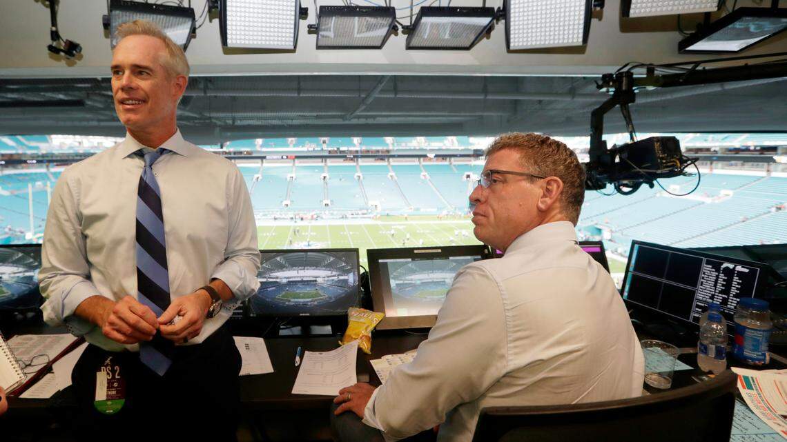 In this Aug. 23, 2019, photo, Fox Sports play-by-play announcer Joe Buck, left, and analyst Troy Aikman work in the broadcast booth before a preseason NFL game between the Miami Dolphins and Jacksonville Jaguars. While on Colin Cowherd’s podcast, Buck admitted that he and Aikman would drink tequila in the broadcast booth while on the job.