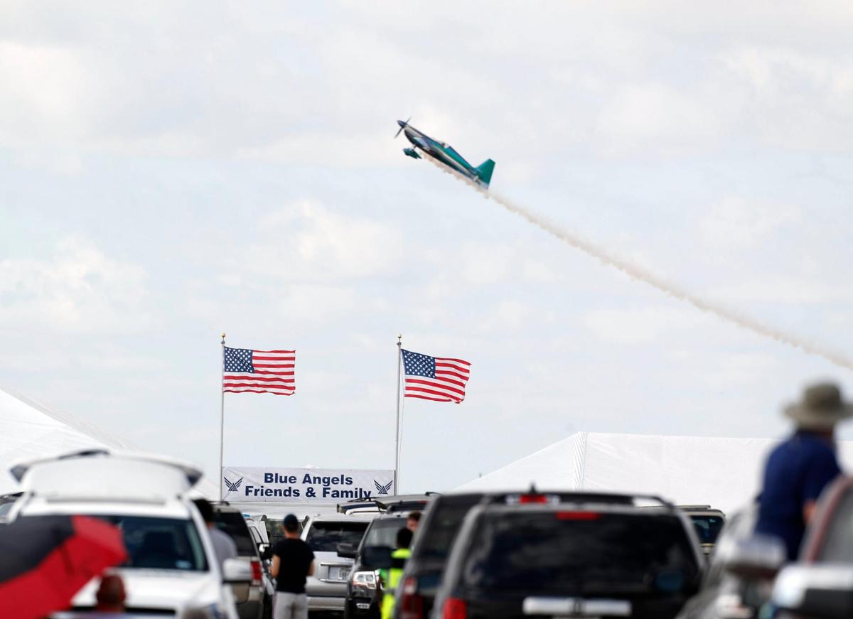 Spectators watched pilots perform from a filled parking area during the Bell Fort Worth Alliance Air Show at Alliance Airport in Fort Worth in 2021.