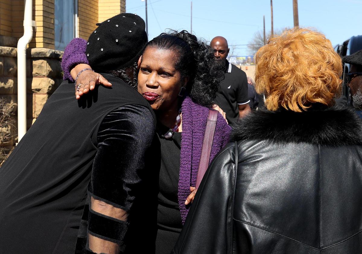 Karen Davis, center, hugs a well-wisher following her father Judge Clifford Davis’ funeral on Tuesday, Feb. 25, at Saint Andrews United Methodist Church in Fort Worth. Davis, the first Black district judge to be elected in Tarrant County, left a long legacy behind including his work to desegregate North Texas schools.