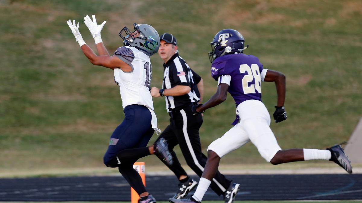 Eaton’s Max McCuiston (13) hauls in a touchdown pass from quarterback Amari Blount (8), defended by Timber Creek’s Jeremy Cook (28). The Eaton Eagles played the the Timber Creek Falcons at Keller ISD Stadium Thursday, September 26, 2019