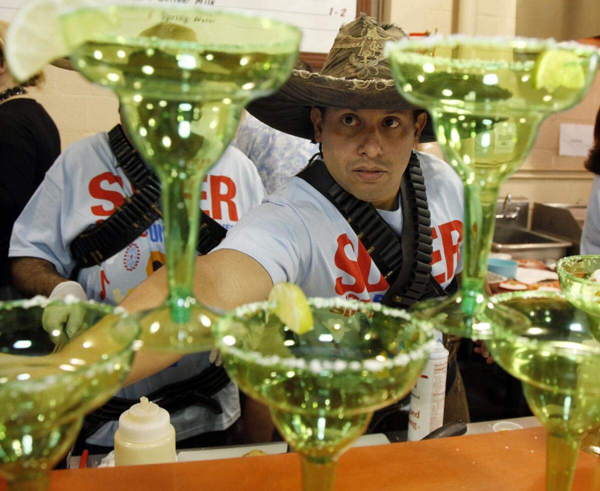 Sept. 6, 2010: Michael Levy of Dallas hands out a sample of the Deep Fried Frozen Margarita. His entry was one of the finalists of the Big Tex Choice Awards at the State Fair of Texas. The sweet and creamy funnel cake batter is coupled with margarita ingredients. It is fried and dusted with a tangy lemon/lime mixture.
