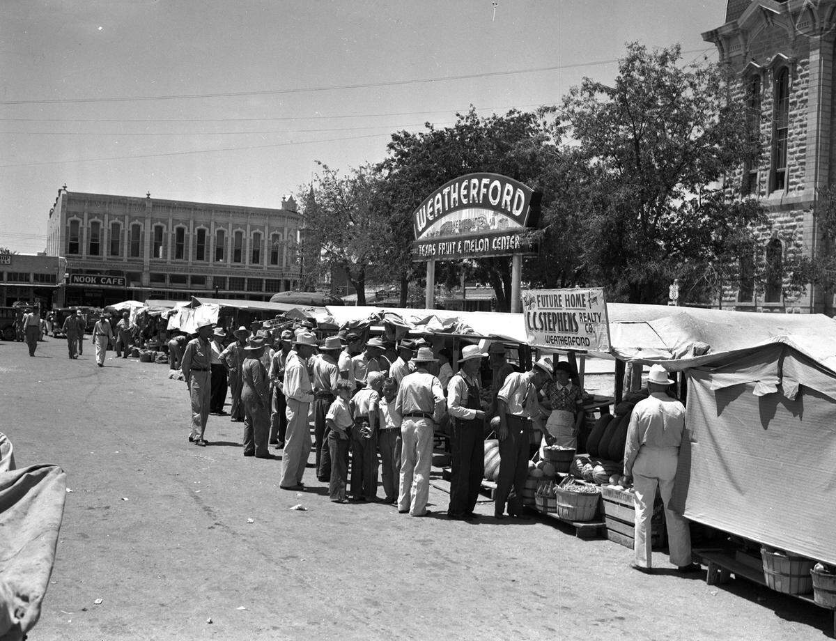 July 8, 1939: At Trading Day in Weatherford, a busy section of the fruit and melon market on the courthouse square