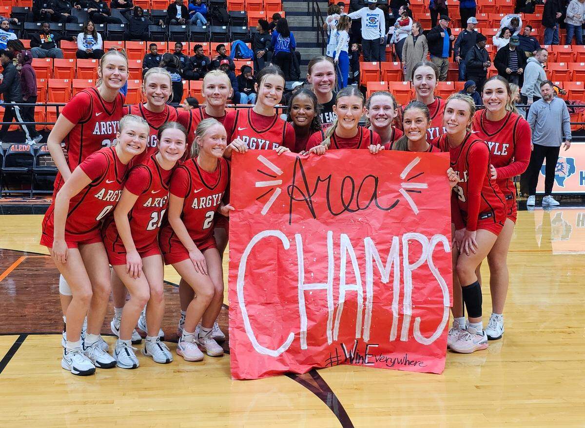 The Argyle Eagles pose after defeating Mansfield Summit in a Class 5A Division 2 area-round game on Thursday, February 13, 2025 at Aledo High School in Aledo, Texas.