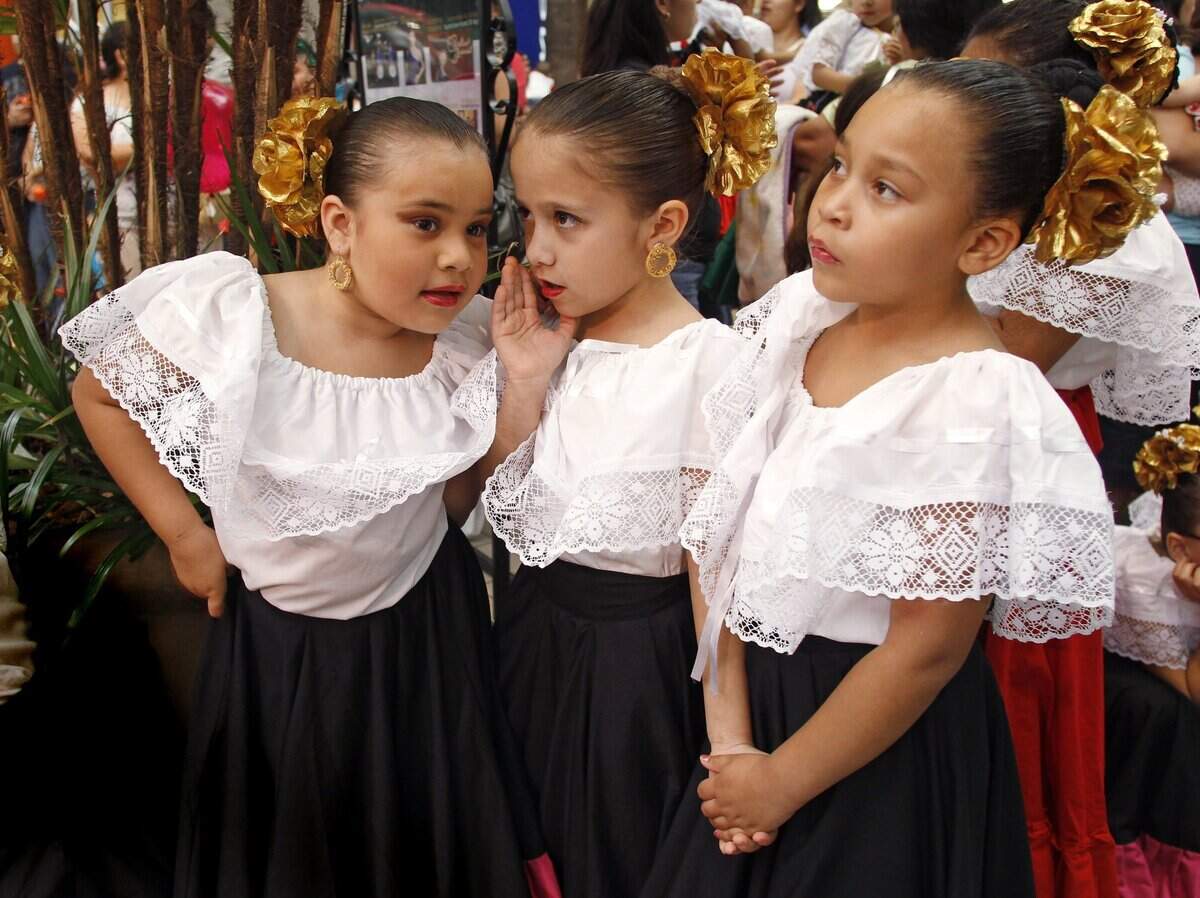 Sept. 15, 2010: Passing time before performing with the Bellet Folcorica Azteca are Genesis Najar, left, Isabela Maschino and Natalie Wright at a celebration of Diez Y Seis de Septiembre at La Gran Plaza.