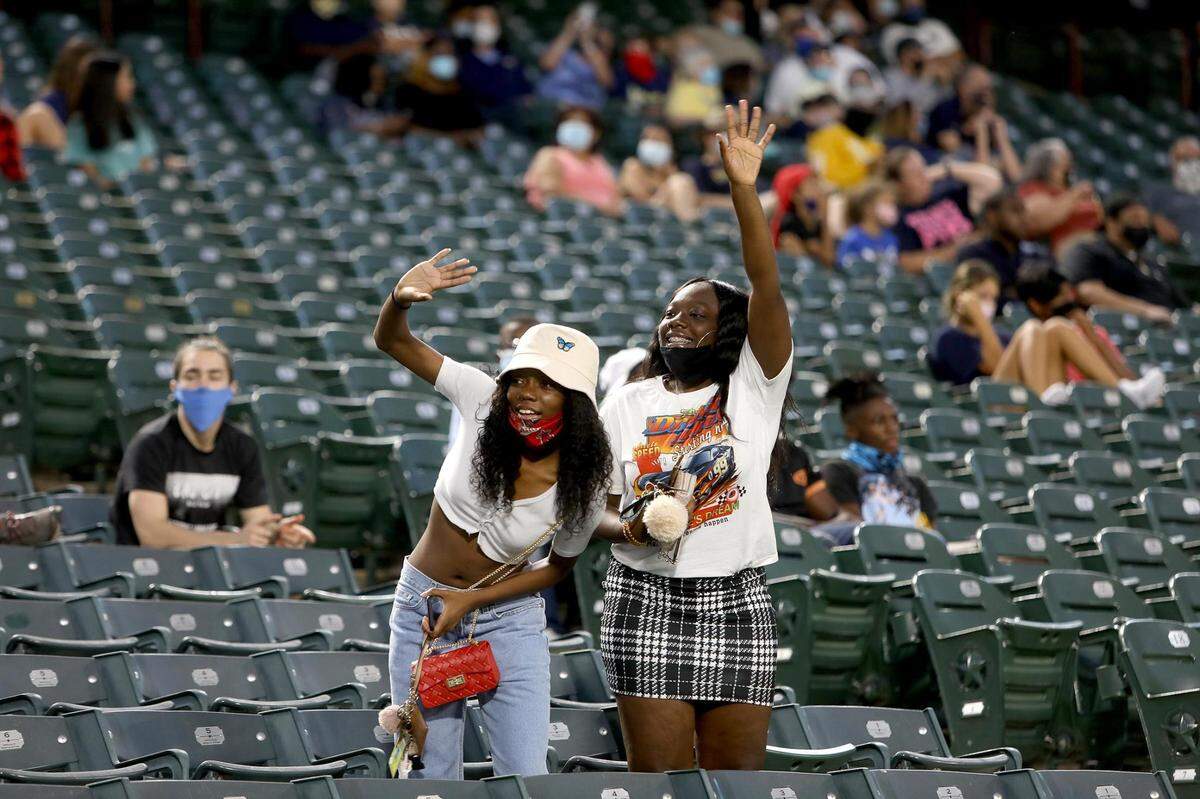 Arlington Lamar fans wave to a friend on the cheer squad on Thursday, September 24, 2020, at Globe Life Park.