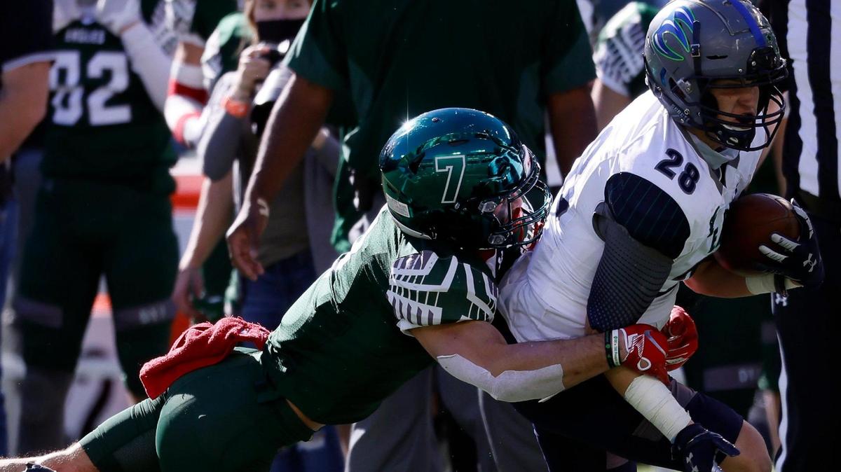 Prosper outside linebacker Mason Jolley (7) brings down Eaton wide receiver Laithe Shelley (28) during a Conference 6A Division 2 regional playoff football game at Globe Life Park in Arlington, Texas, Saturday, Dec. 26, 2020. Prosper defeated Eaton 27-17. (Special to the Star-Telegram Bob Booth)
