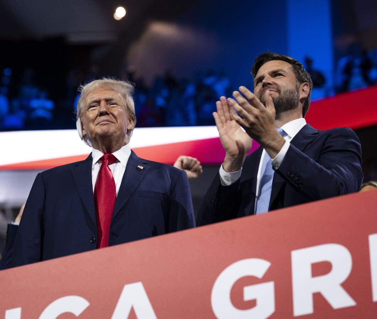 President-elect Donald Trump appears with Vice President-elect JD Vance on the first night of the Republican National Convention at the Fiserv Forum in Milwaukee in July. Vance has said mass deportations would remove criminals from the country and stop undercutting wages for U.S. citizens.