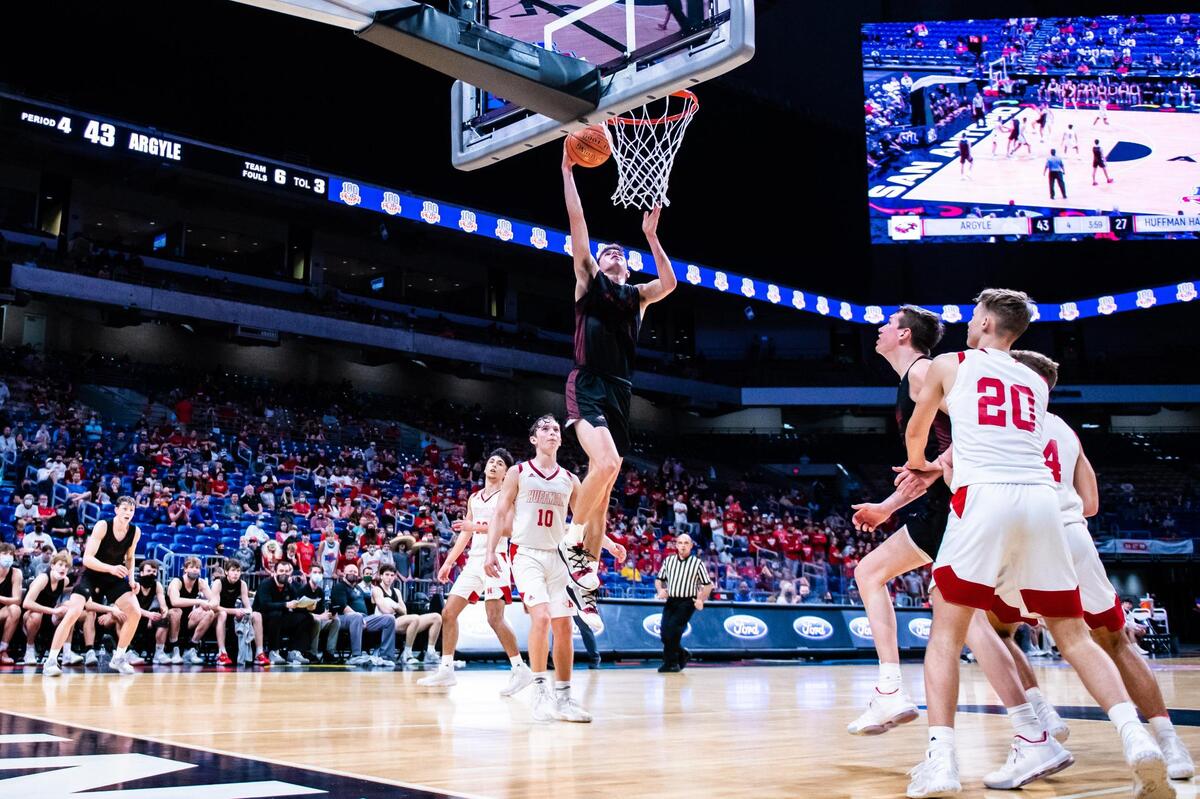 Eli Valentino (23) drives down an open lane for a layup during the 4A state final between Argyle and Huffman Hargrave at the Alamodome in San Antonio Texas, on March 13, 2021. Argyle went on to win 49-30. (Photo by Matt Smith. Special to the Star-Telegram).
