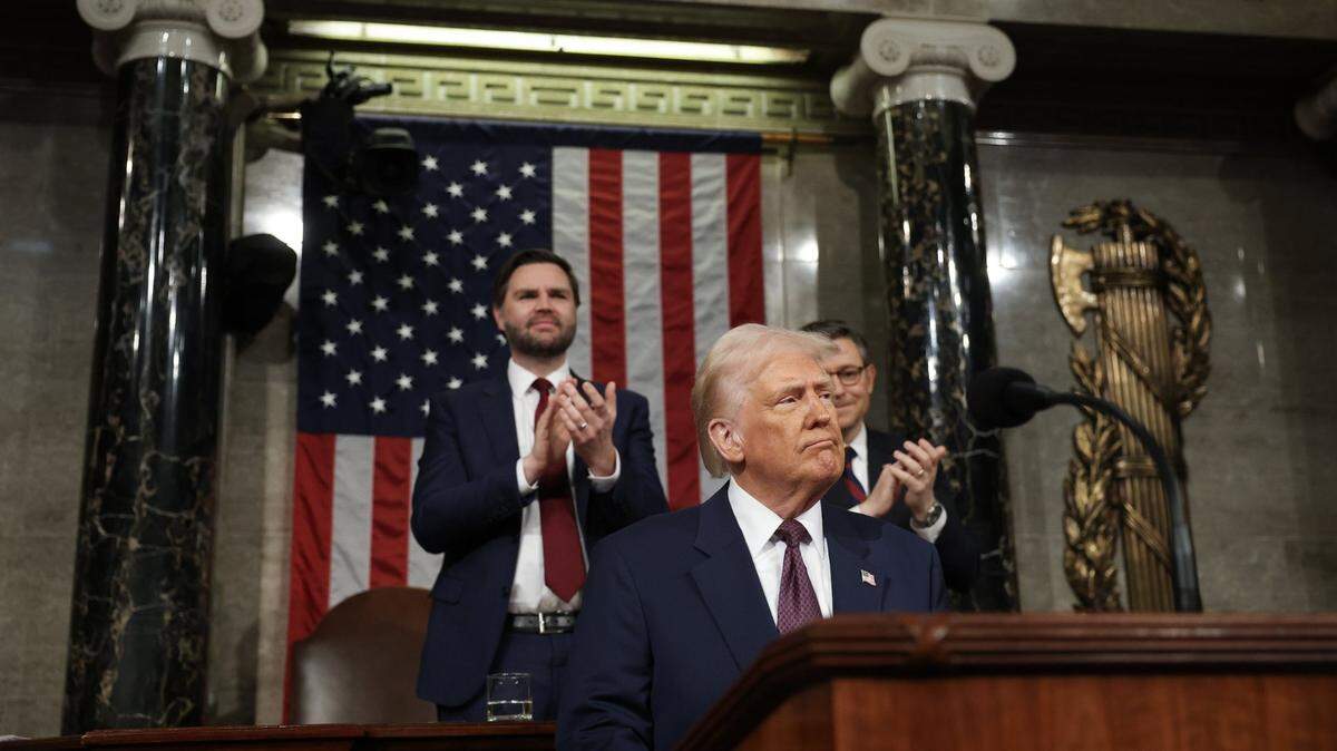 Mar 4, 2025; Washington, DC, USA; U.S. President Donald Trump addresses a joint session of Congress at the U.S. Capitol on March 04, 2025 in Washington, DC. Vice President JD Vance and Speaker of the House Mike Johnson (R-LA) applaud behind him. President Trump was expected to address Congress on his early achievements of his presidency and his upcoming legislative agenda. Mandatory Credit: Win McNamee-Pool via Imagn Images