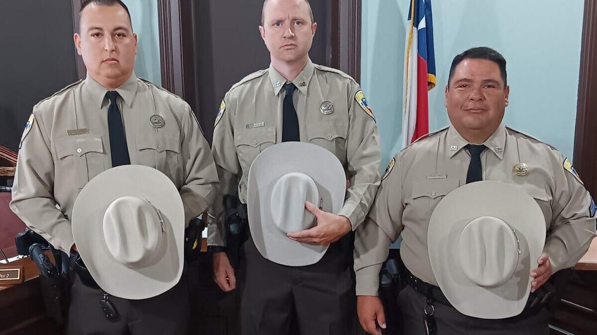 Parker County Sheriff’s Deputies (from left) Joseph Evans, Randy Lawson and Corporal Luis Montanez were awarded the Life-Saving Award during a Parker County Commissioners Court session.