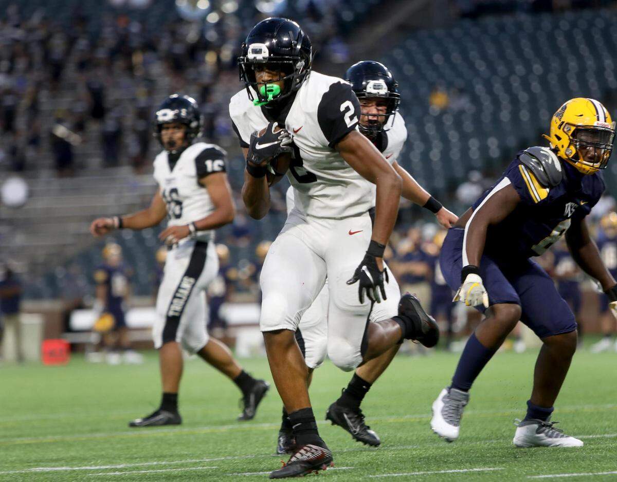 Euless Trinity running back Ollie Gordon runs the ball in for a touchdown against Arlington Lamar on Thursday, September 24, 2020, at Globe Life Park.