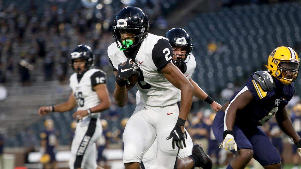 Euless Trinity running back Ollie Gordon rushed for 460 yards and six touchdowns in the Trojans’ 49-45 win over Allen at Globe Life Park on Saturday.