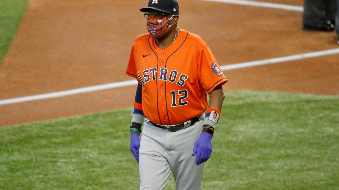 Houston Astros manager Dusty Baker Jr. walks across the field before a baseball game against the Texas Rangers in Arlington, Texas, Sunday, Sept. 27, 2020. (AP Photo/Roger Steinman)