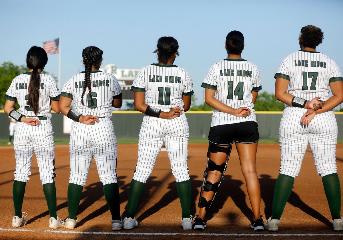 Lady Eagle players line up for the national anthem before a UIL 6A Region 2 area round softball name at Lake Ridge High School in Mansfield, Texas, Friday, May 06, 2022. Lake Ridge defeated Tyler Legacy 6-3 on 16 hits and no errors to move on to the next round. (Special to the Star-Telegram Bob Booth)