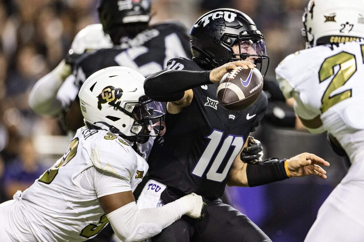 TCU quarterback Josh Hoover (10) is sacked from behind from Colorado defensive lineman Arden Walker (53) in the first half of an NCAA football game between TCU and Colorado at Amon G. Carter Stadium in Fort Worth on Saturday, Oct. 4, 2025.