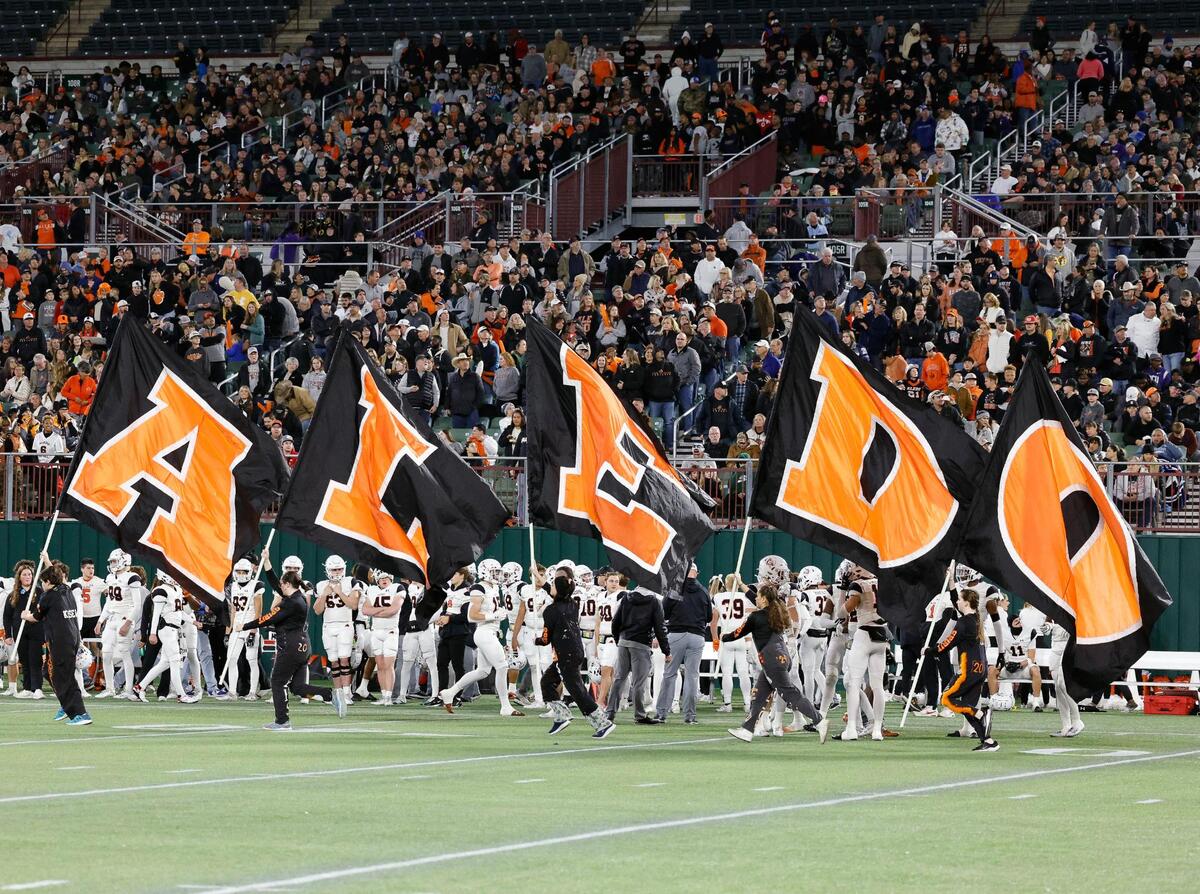 Aledo’s flag runners celebrate a touchdown in the first half of a Conference 5A Division 1 UIL Regional football playoff game at Choctaw Stadium in Arlington, Texas, Friday, Oct. 24, 2023.