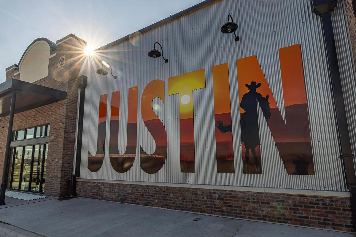 A mural on the side of a newly constructed building in Justin Town Square.