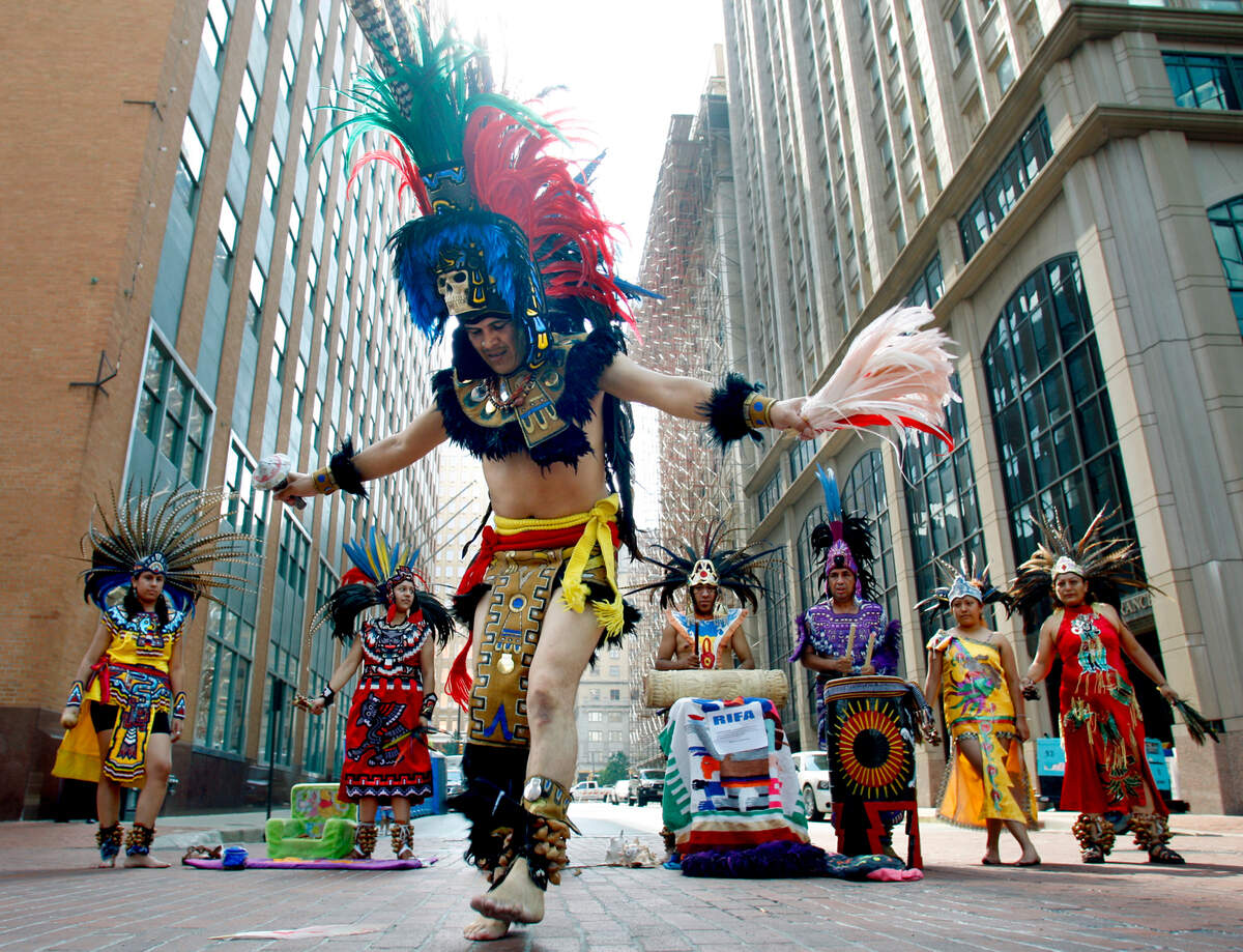 Sept. 16, 2007: Rene Sanchez dances with the Aztec dance group, Cuicani in Xochitl, during Fiesta Fort Worth de Septiembre in downtown, celebrating Mexican Independence Day.