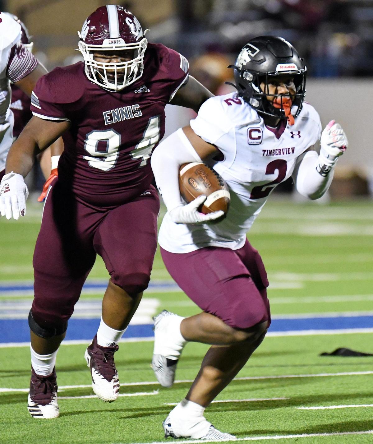 Mansfield Timberview’s Duece Jones, right, breaks past Ennis’s Octavius Johnson for a 40 yard touchdown run for a 14-14 tie in the second quarter of their Division 2 Region 2-5A Area Play-off football game Friday, December 18, 2020 at the Midlothian ISD Athletic Facilities in Midlothian, Texas. Special/Bob Haynes