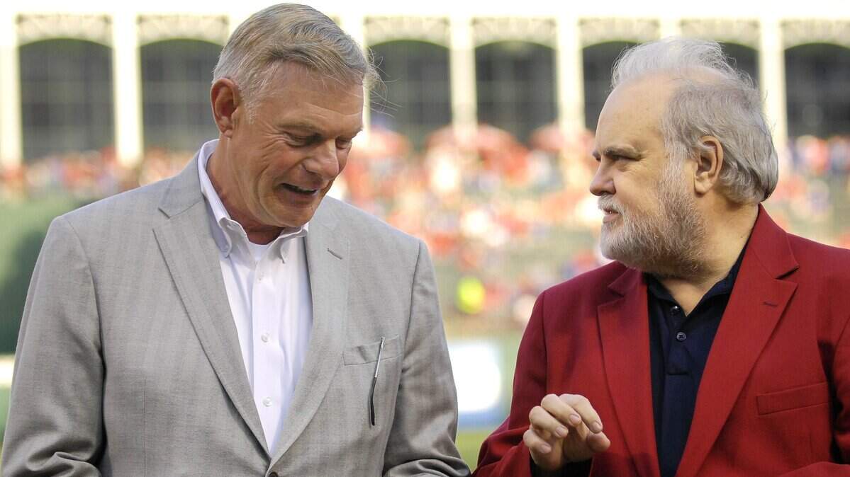 The Texas Rangers ownership group of Ray Davis, left, and Bob Simpson have decided to pay the baseball operations staff through May 31.