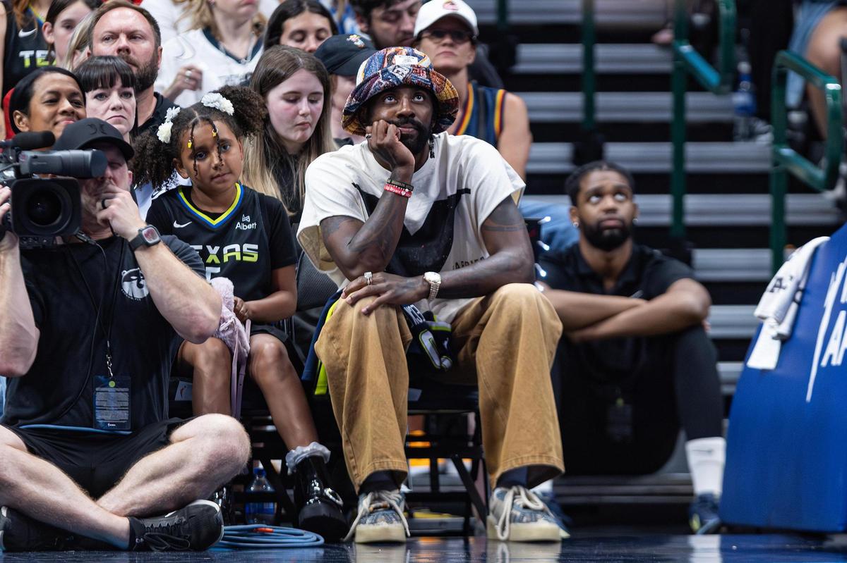 Dallas Mavericks guard Kyrie Irving side under the basket for the WNBA game between the Dallas Wings and Indiana Fever at the American Airlines Center in Dallas on Friday, June 27, 2025.