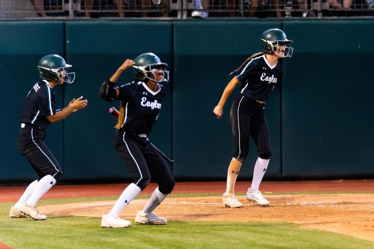 The Eagles celebrate scoring two more runs during the 6A UIL State Softball semifinal between Lake ridge and Deer Park in Austin Texas, on June 3rd, 2021.