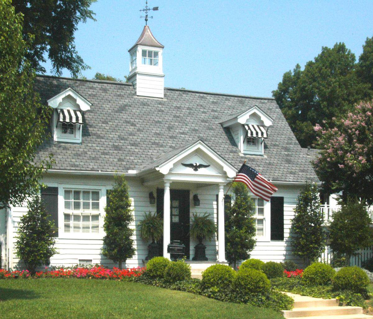 Plan beds to showcase your entryway to make it the focal point of your home.