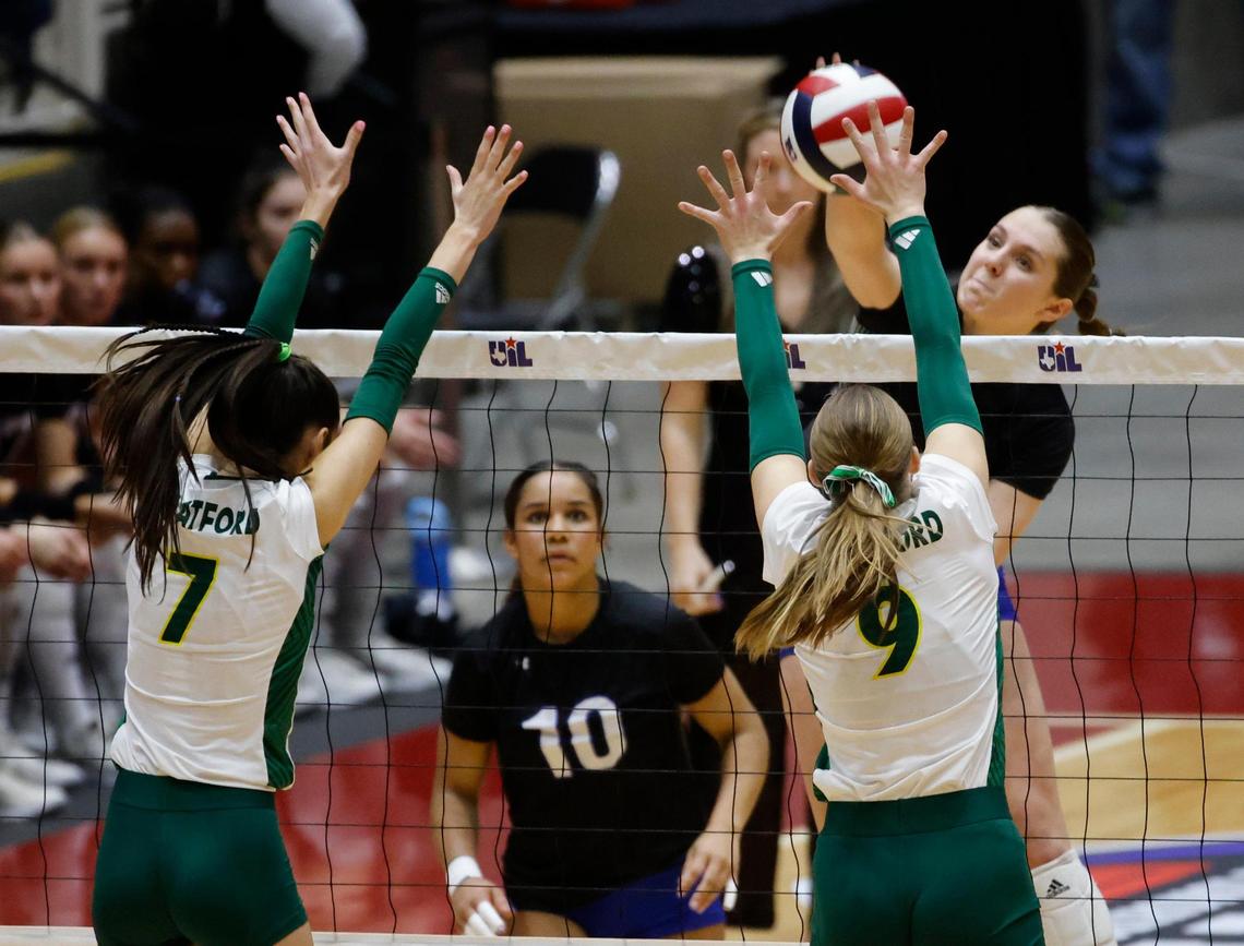 Byron Nelson Kylie Kleckner (2) drives one between Houston Stratford Avery Kent (7) and Tess Stephenson (9) during the UIL 6A D2 State Final volleyball match at Curtis Culwell Center in Garland Texas, Saturday, Nov. 23, 2024.