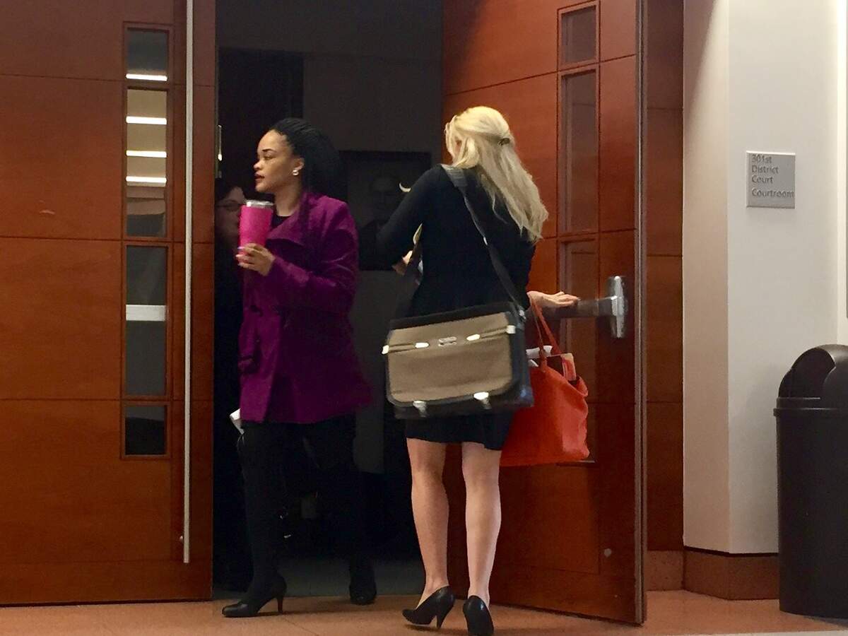 Kaylene Bowen, left, leaves the 301st Family District Court Monday following a hearing.