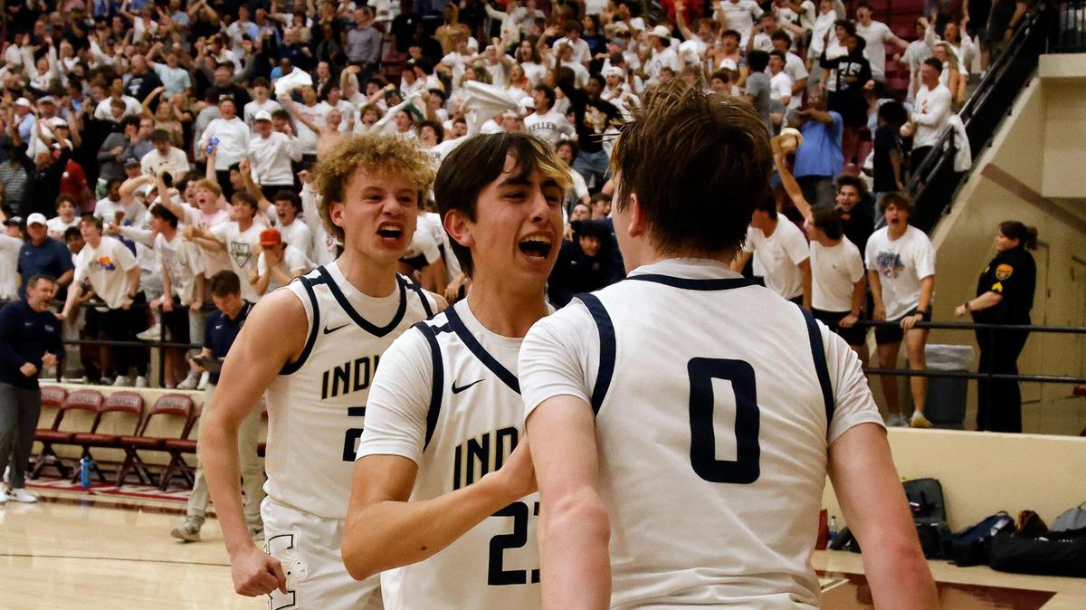 Keller guards Evan Collins (22), Evan Guerra (23) and Alex Peterson (0) celebrate winning the Conference 6A Region 1 quarterfinals basketball playoffs at Saginaw High School in Saginaw, Texas, Tuesday, Feb. 27, 2024.